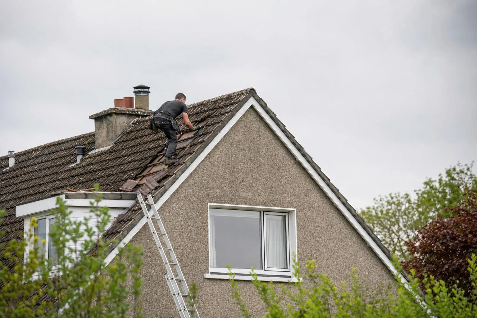Roofer carrying out repairs on a Limerick home